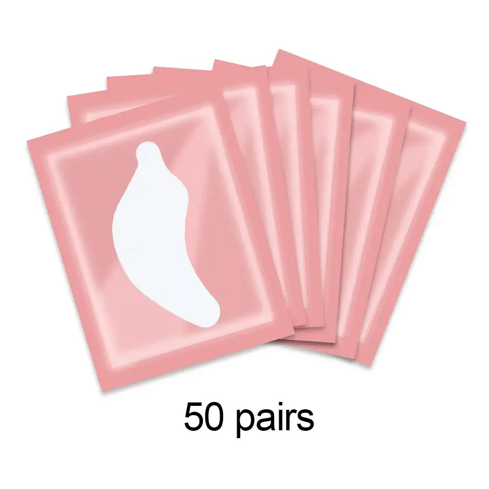 Pink eye patches with a banana-shaped cutout, labeled ’50 pairs’.