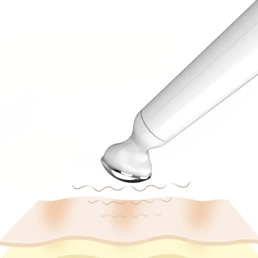 Handheld ultrasound device emitting waves onto skin.