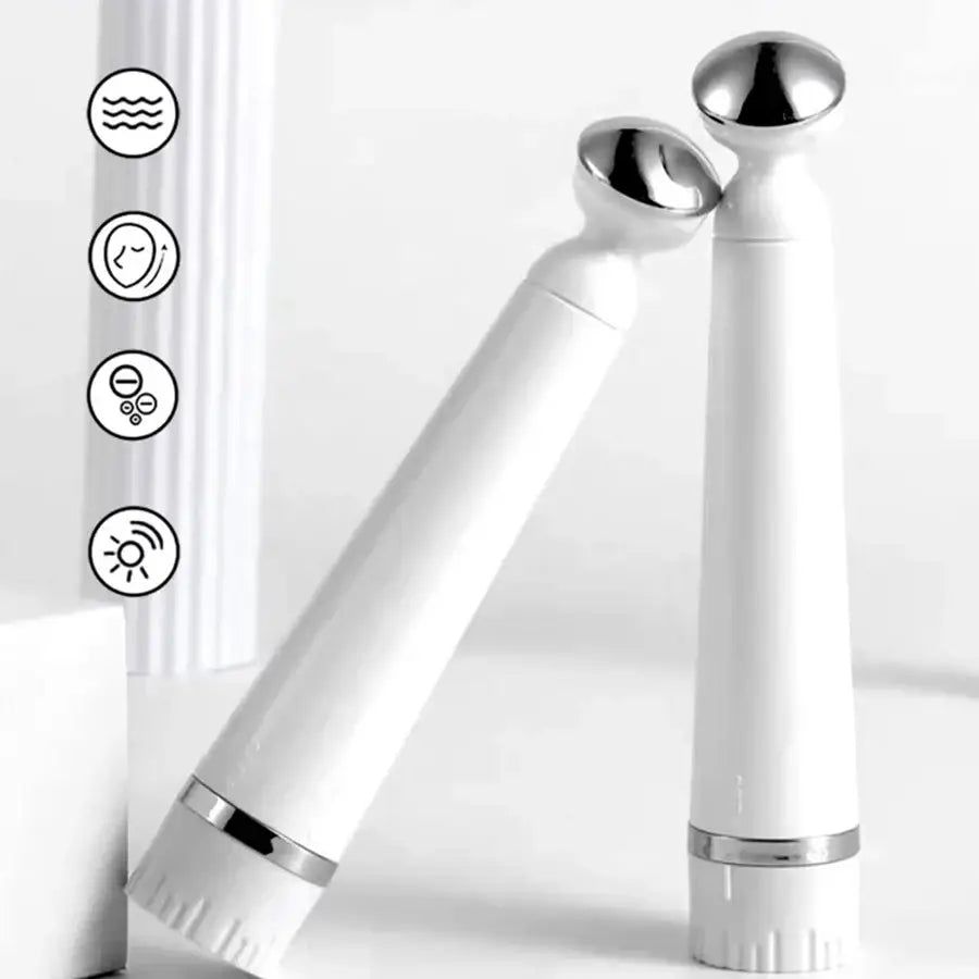 Sleek white electric toothbrush with a metallic accent and angled brush head.