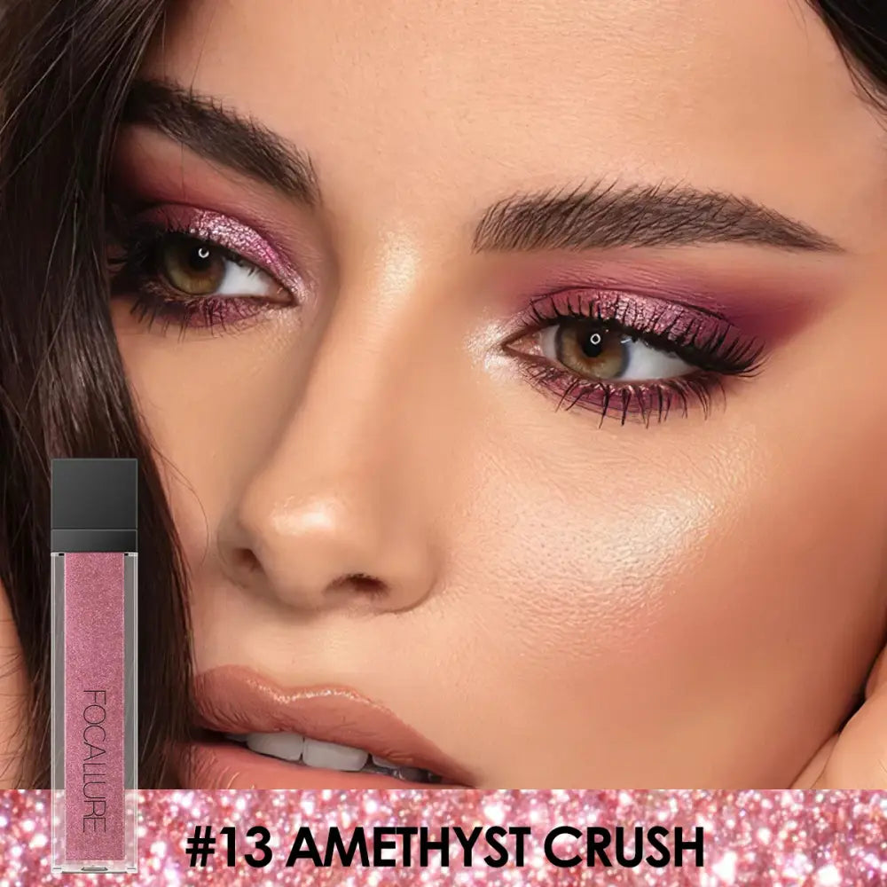 Close-up of a person’s face with vibrant purple eyeshadow and glossy lips, alongside a pink lip product labeled ’#13 Amethyst Crush’.