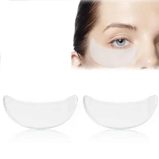 Pair of white, crescent-shaped under-eye patches or masks.