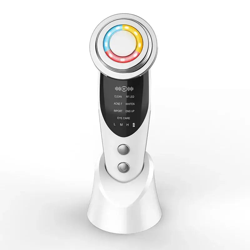 Handheld electronic beauty device with a circular light-up head and digital display panel.