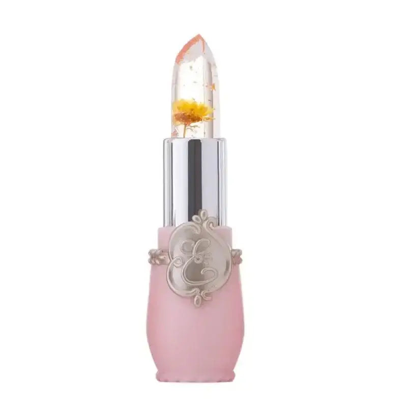 Ornate lipstick with a clear and gold-flecked tip in a pink and silver case.