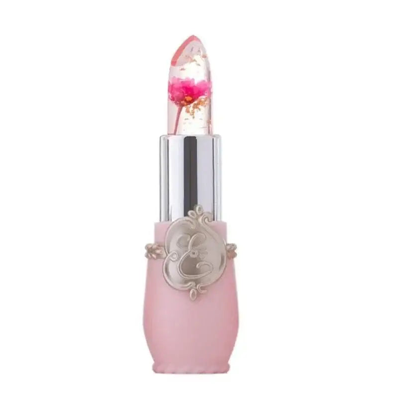 Pink lipstick with a clear cap and decorative silver base.