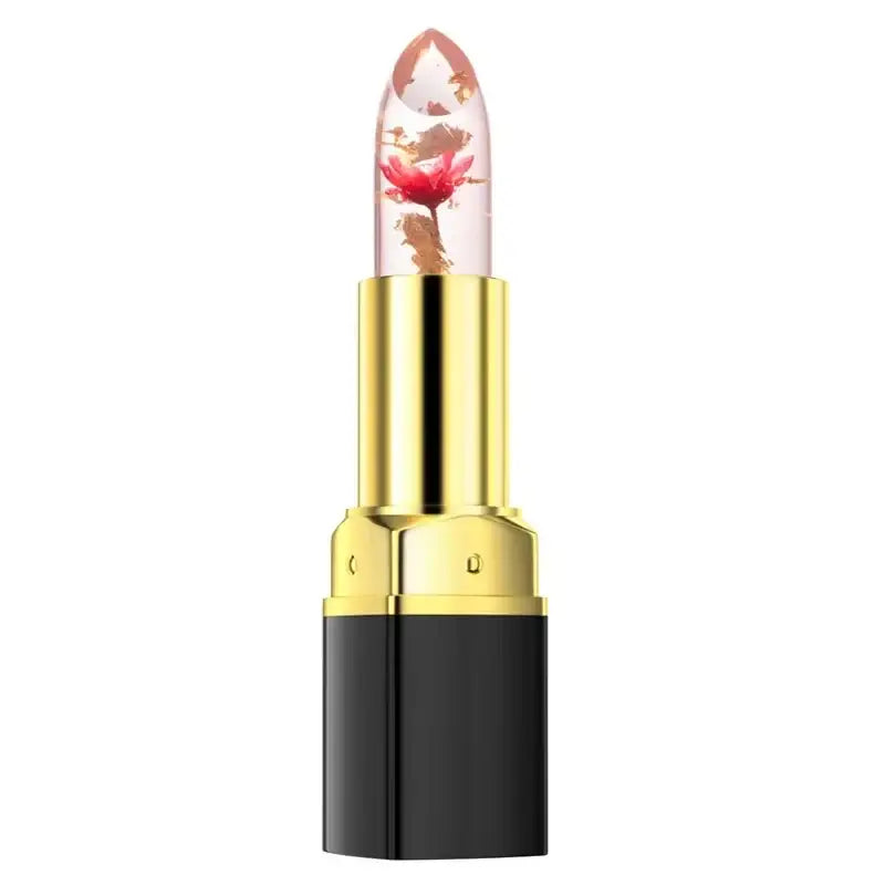 Transparent lipstick with a visible red flower inside, set in a gold and black tube.