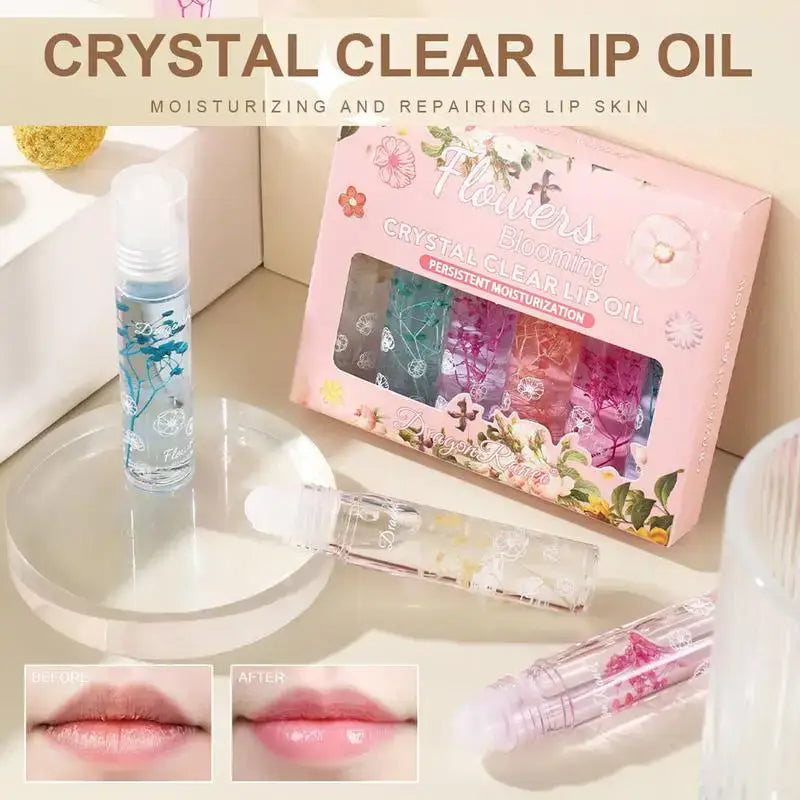 Crystal clear lip oil set with multiple colorful vials in a decorative box.