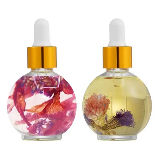 Two glass bottles containing colorful flower petals in liquid, with dropper caps.