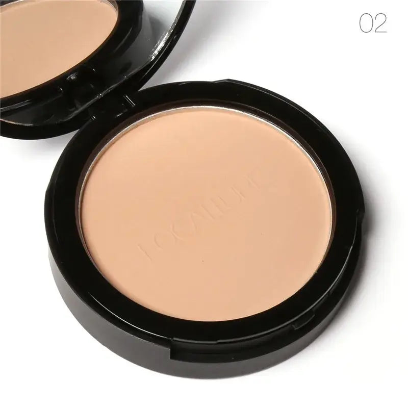 Compact powder makeup in a round black case with beige-colored pressed powder inside.