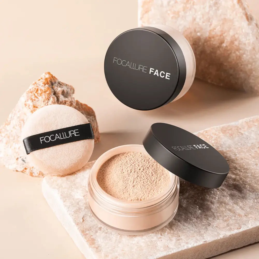 Loose face powder with compact containers and a powder puff.