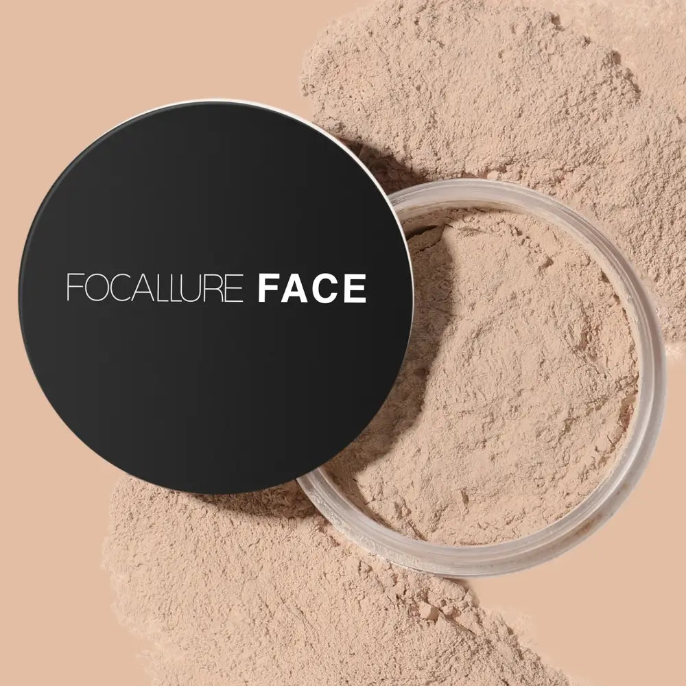 Loose face powder in a black compact container labeled ’FOCALLURE FACE’.