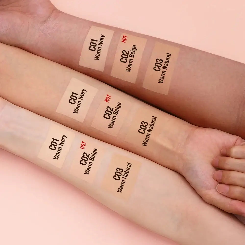 Swatches of foundation makeup in different shades on human skin.