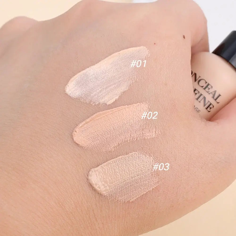 Swatches of three different shades of foundation or concealer on skin.