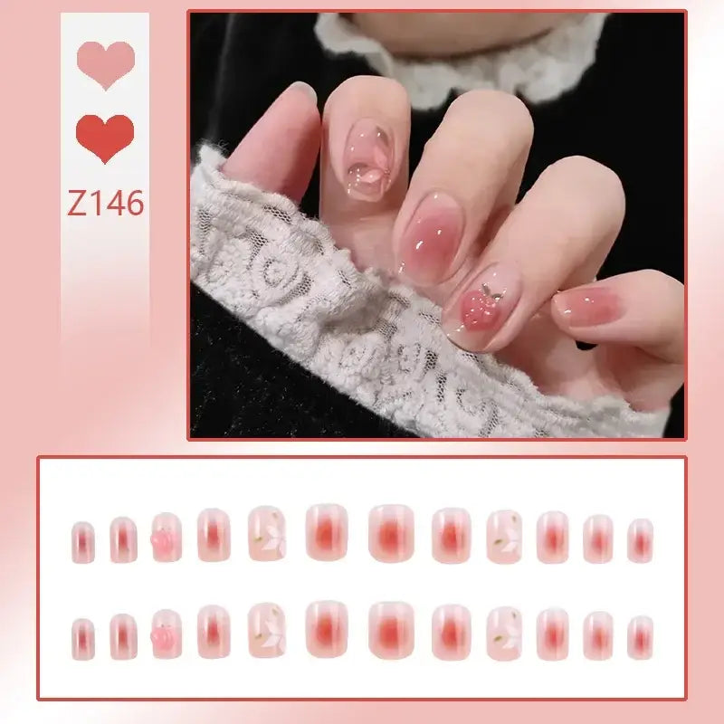 Manicured fingernails with pink and nude polish designs.