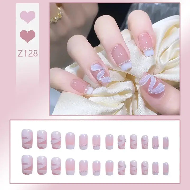 Manicured fingernails with pink and white French tip design.