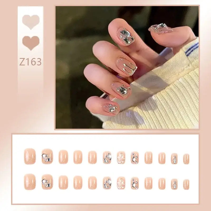 Manicured nails with decorative nail art featuring floral and geometric designs.