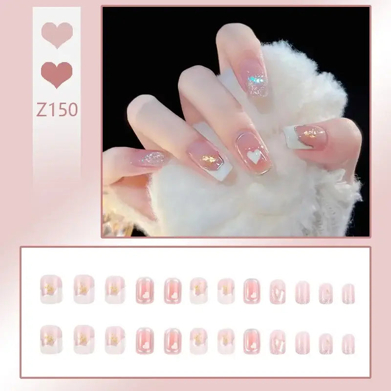 Manicured hand with pink and glittery nail art resting on fluffy white cotton or fur.