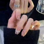 Glitter and Crystal Acrylic Nails with Butterfly Ring - Vignette | VogueBeautify