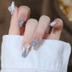 Glitter and Crystal Acrylic Nails with Butterfly Ring - Vignette | VogueBeautify