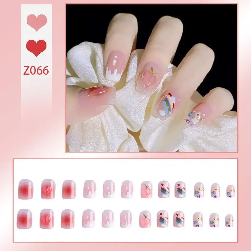 Set of artificial nails with pink and floral designs.