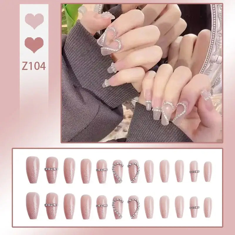 Set of artificial nails in pale pink with glittery silver accents.