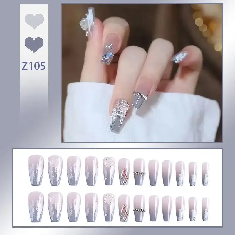 Set of long, coffin-shaped artificial nails with a glittery silver and white ombre design.