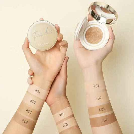 Makeup compact with different foundation shade swatches on arms.