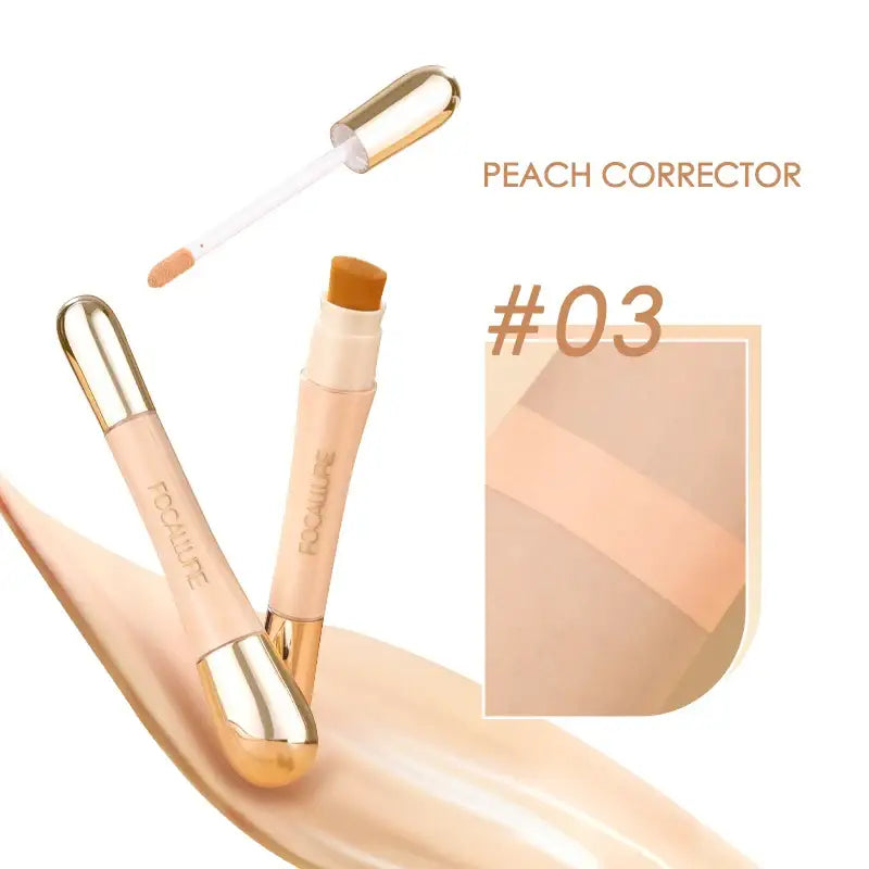 Peach-colored makeup concealer or corrector stick with gold accents.