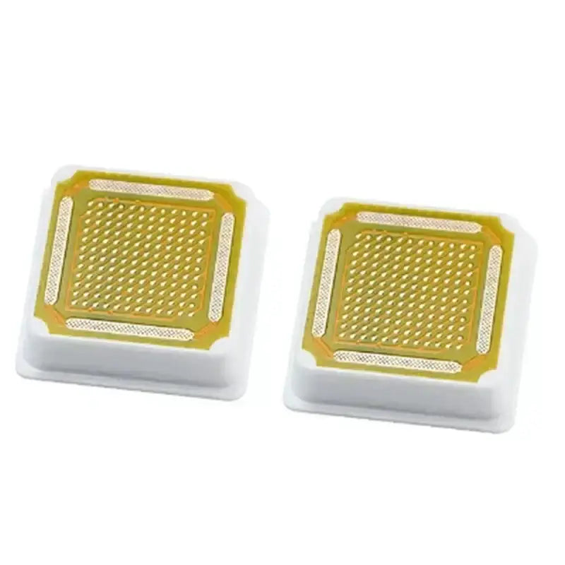 Two square yellow and white air freshener devices with perforated tops.