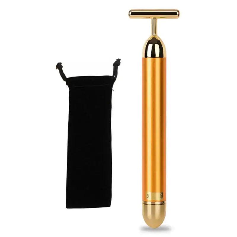 Gold-colored facial massage tool with a T-shaped handle.