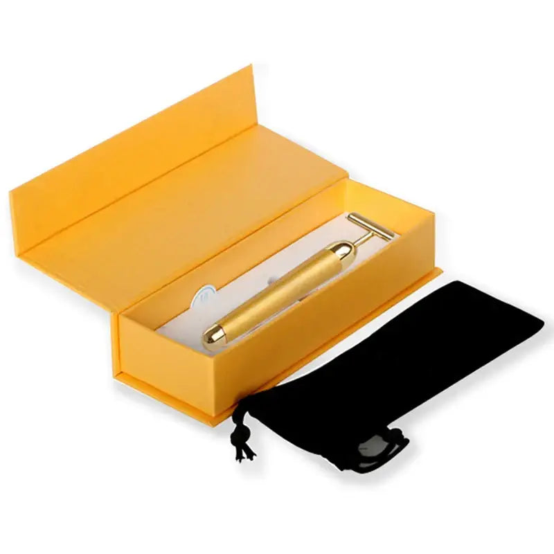 Yellow gift box containing a gold pen.