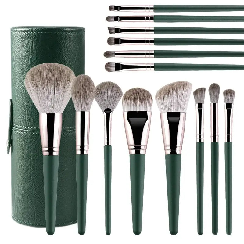 Set of makeup brushes with green handles and a matching green brush holder.