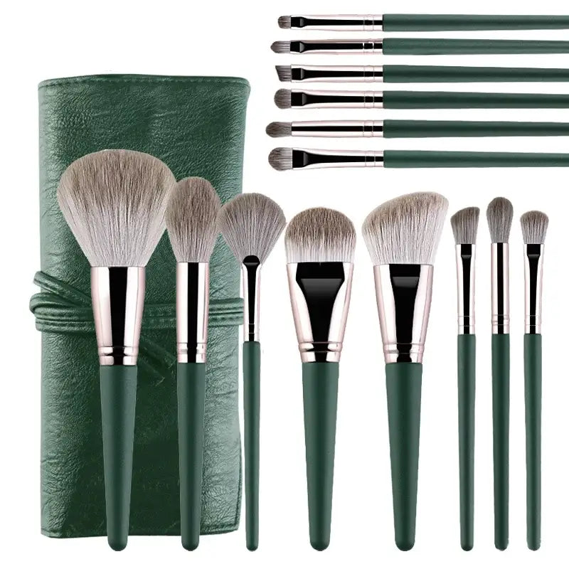 Set of makeup brushes with green handles and a matching green brush holder.