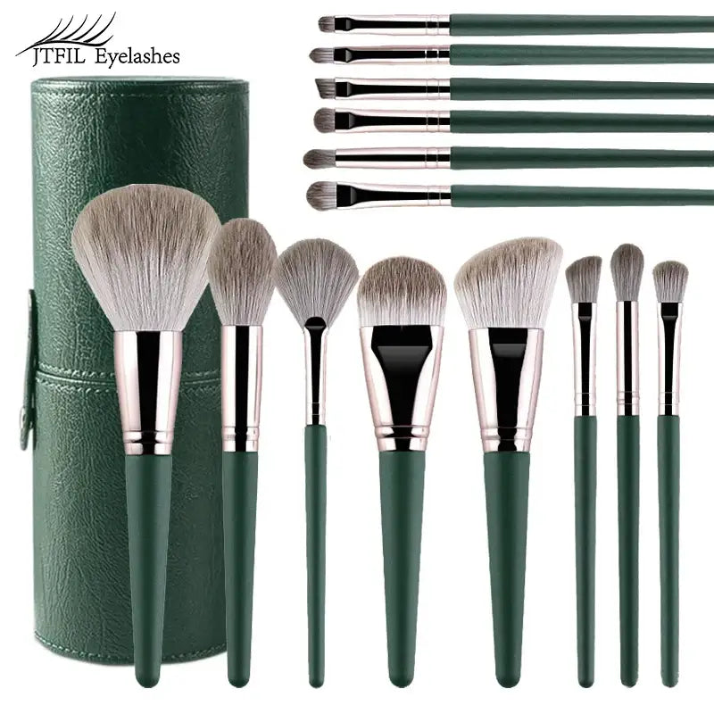 Set of makeup brushes with green handles and a matching cylindrical case.