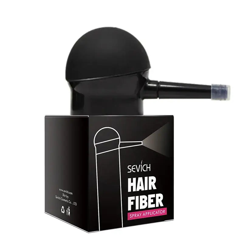 Hair fiber applicator with a black spherical top and nozzle for dispensing fibers.