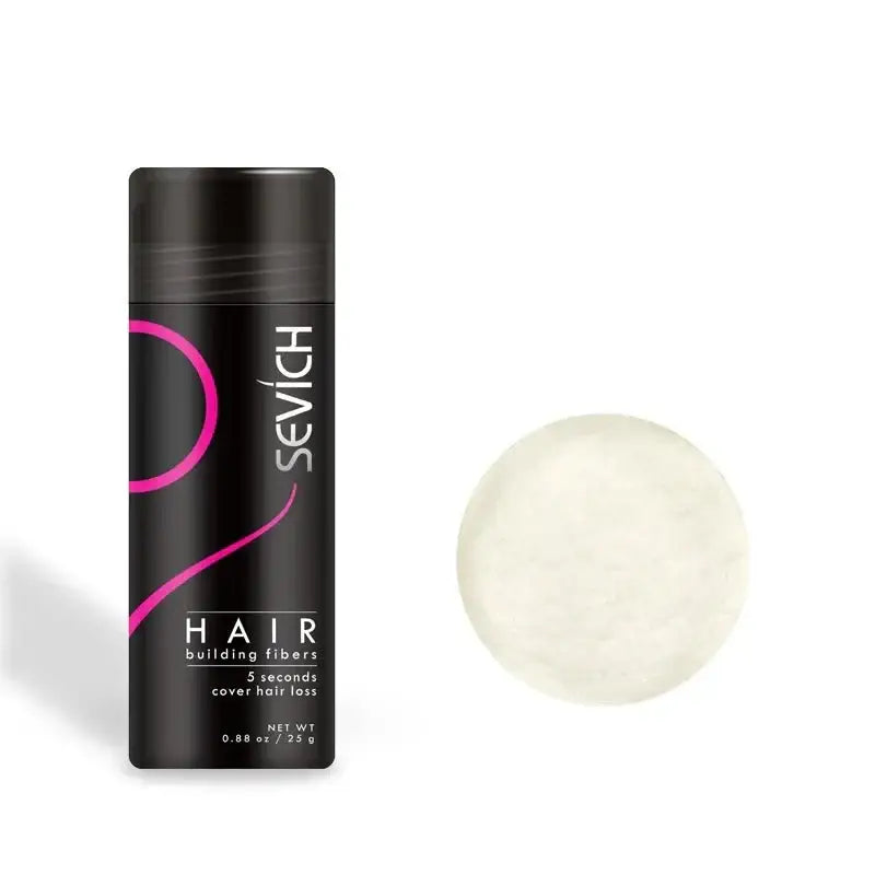 Hair building fibers product in a black cylindrical container with pink accents.