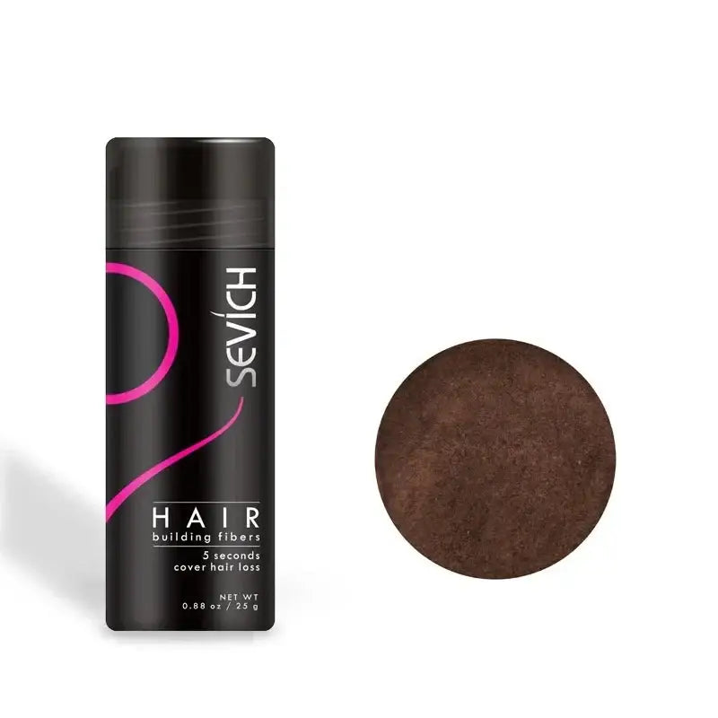 Hair building fibers product in a black cylindrical container with pink accents.