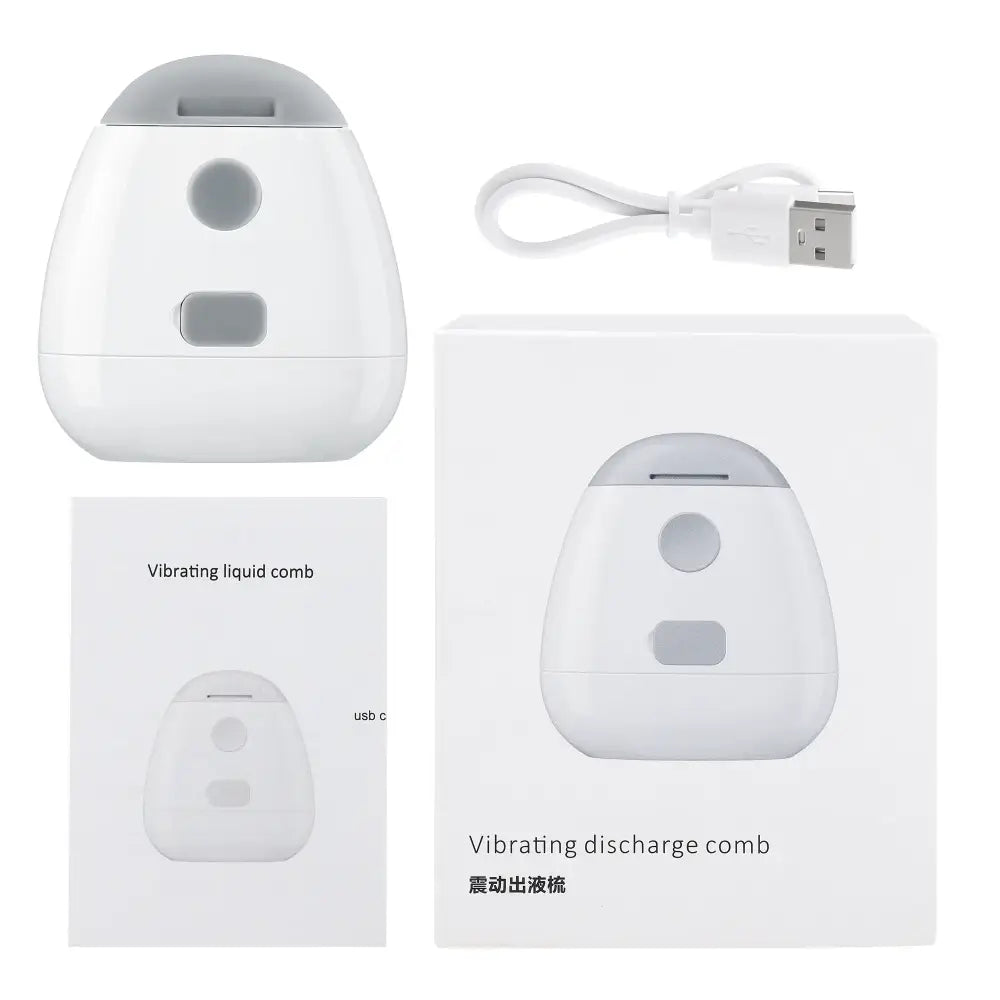 White egg-shaped electronic device labeled as a ’Vibrating discharge comb’ with a USB charging cable.