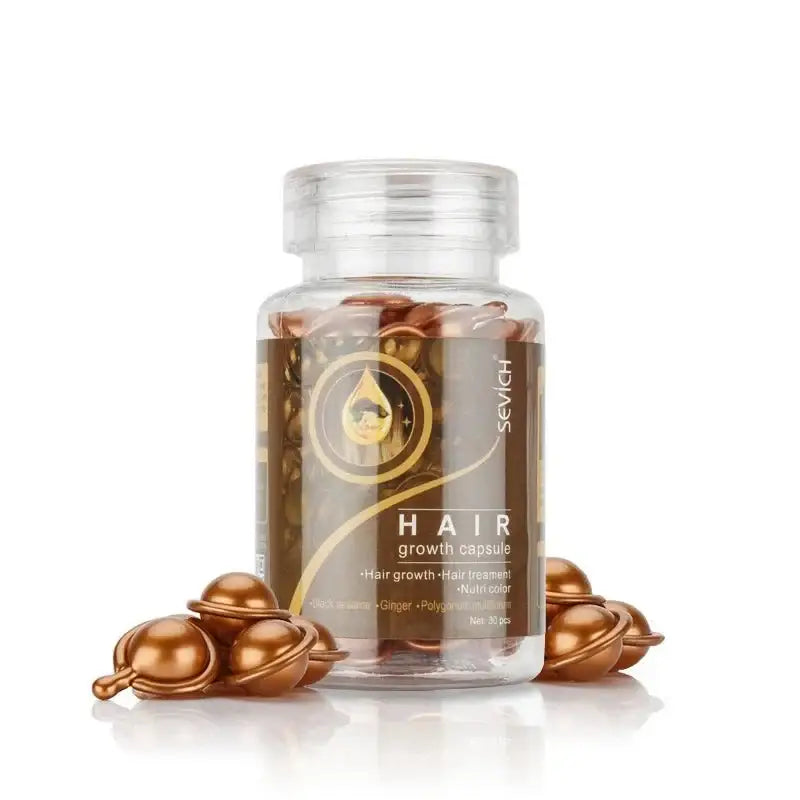 Clear bottle containing golden capsules labeled as hair growth supplements.