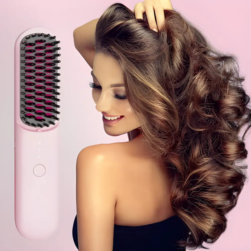 Hair straightening brush with pink handle and black bristles.