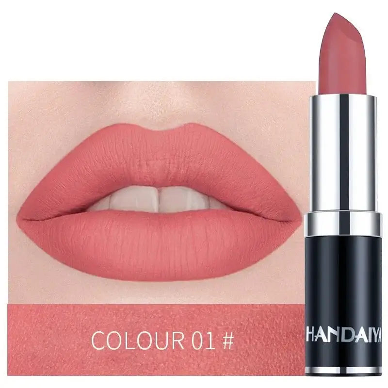 Coral pink lipstick with a matching lip swatch.