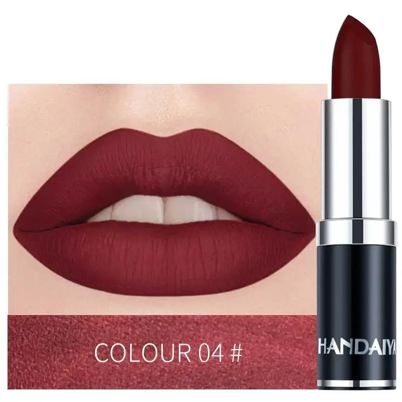 Deep red matte lipstick shown both as a product and applied to lips.