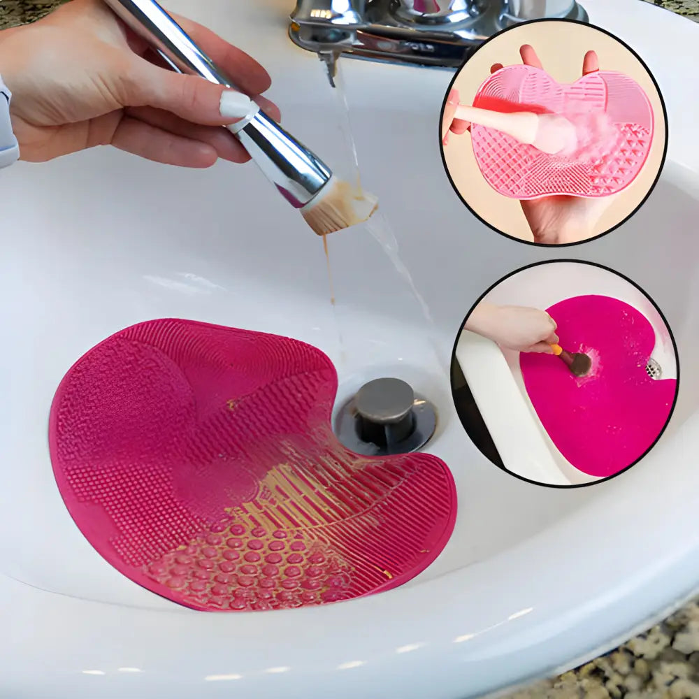 Pink silicone makeup brush cleaning mat with textured surface patterns.