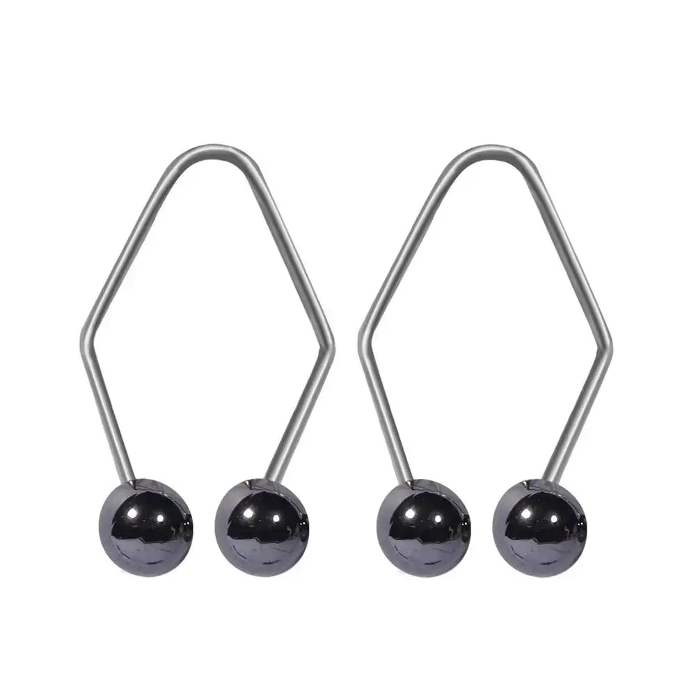 Pair of hexagonal-shaped metal earrings with black spherical beads.