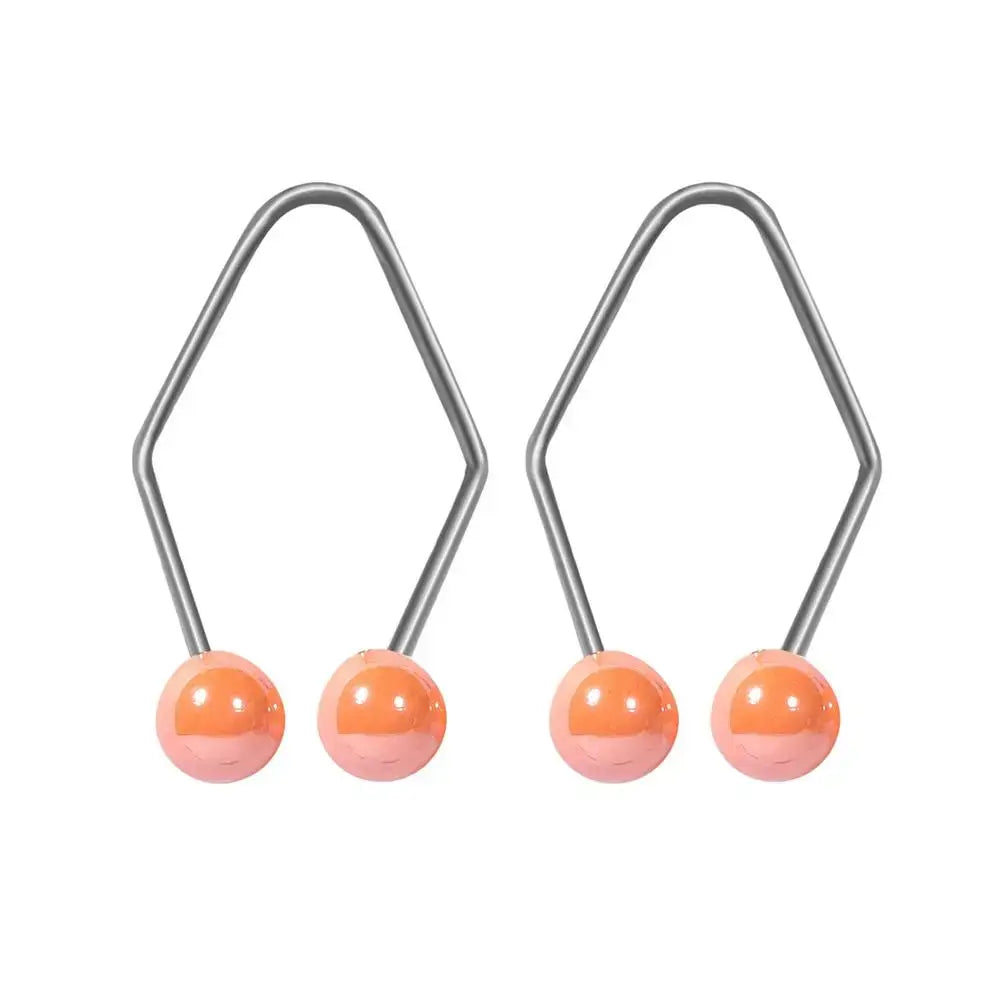 Pair of silver hexagonal-shaped earrings with orange spherical beads.