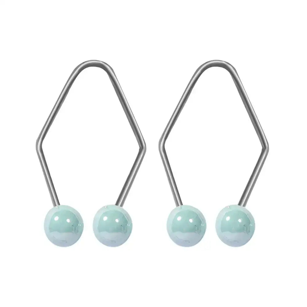 Pair of silver earrings with light blue spherical beads.