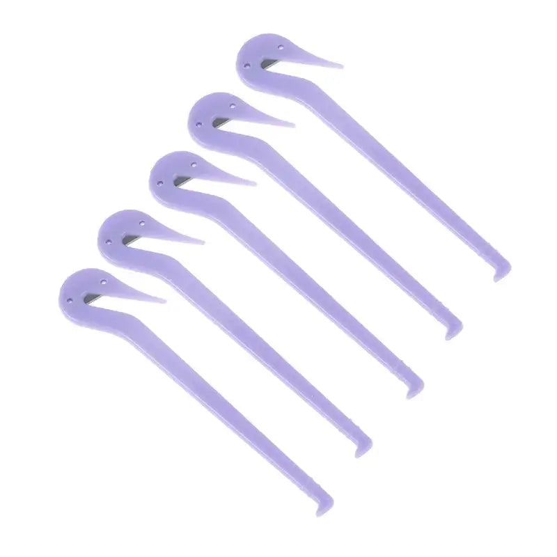 Set of purple plastic crochet hooks arranged in a row.