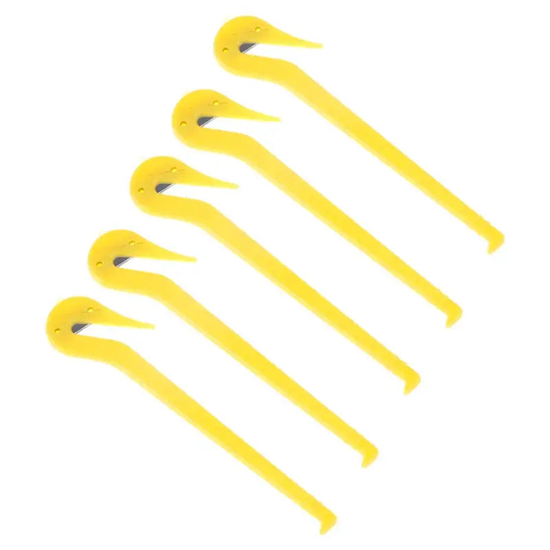 Yellow plastic tent stakes or pegs arranged in a fan-like pattern.