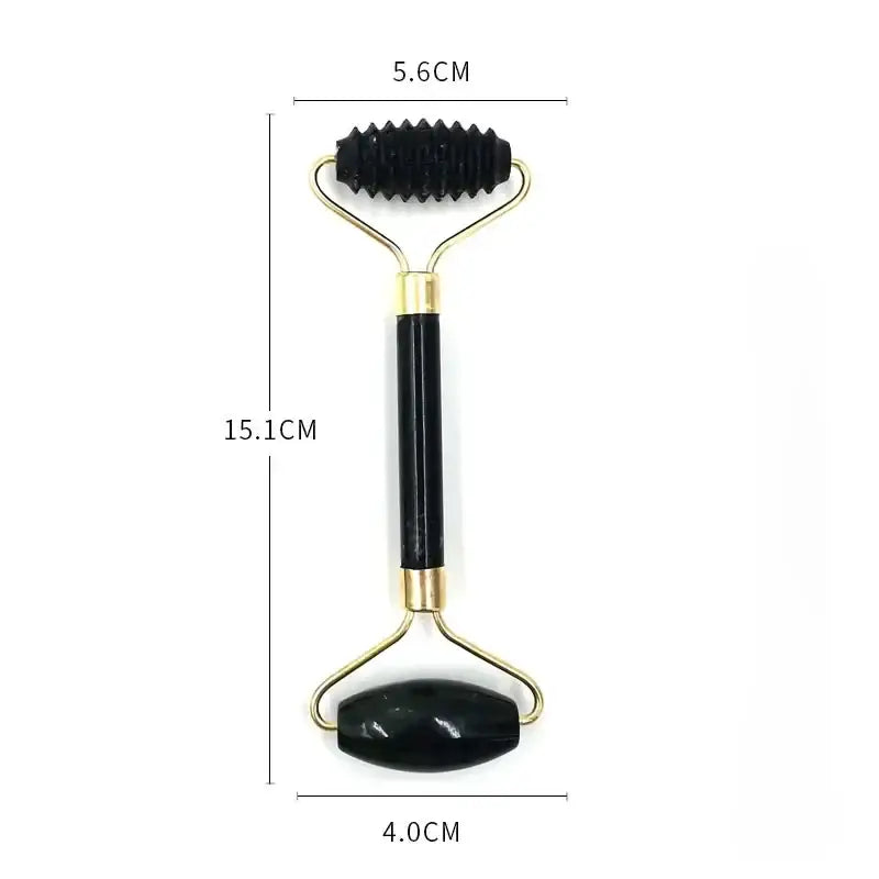 Facial massage roller with a black handle and gold-colored metal ends.