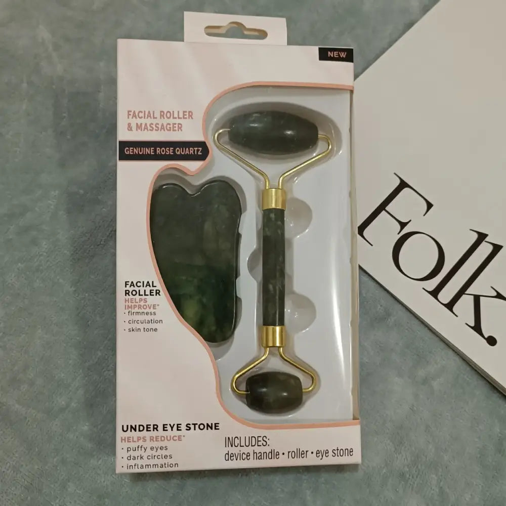 Facial roller and massager set with a green stone tool and gold-toned handle.