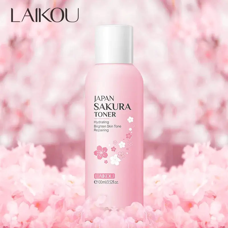 Pink bottle of Japan Sakura Toner with cherry blossom design.